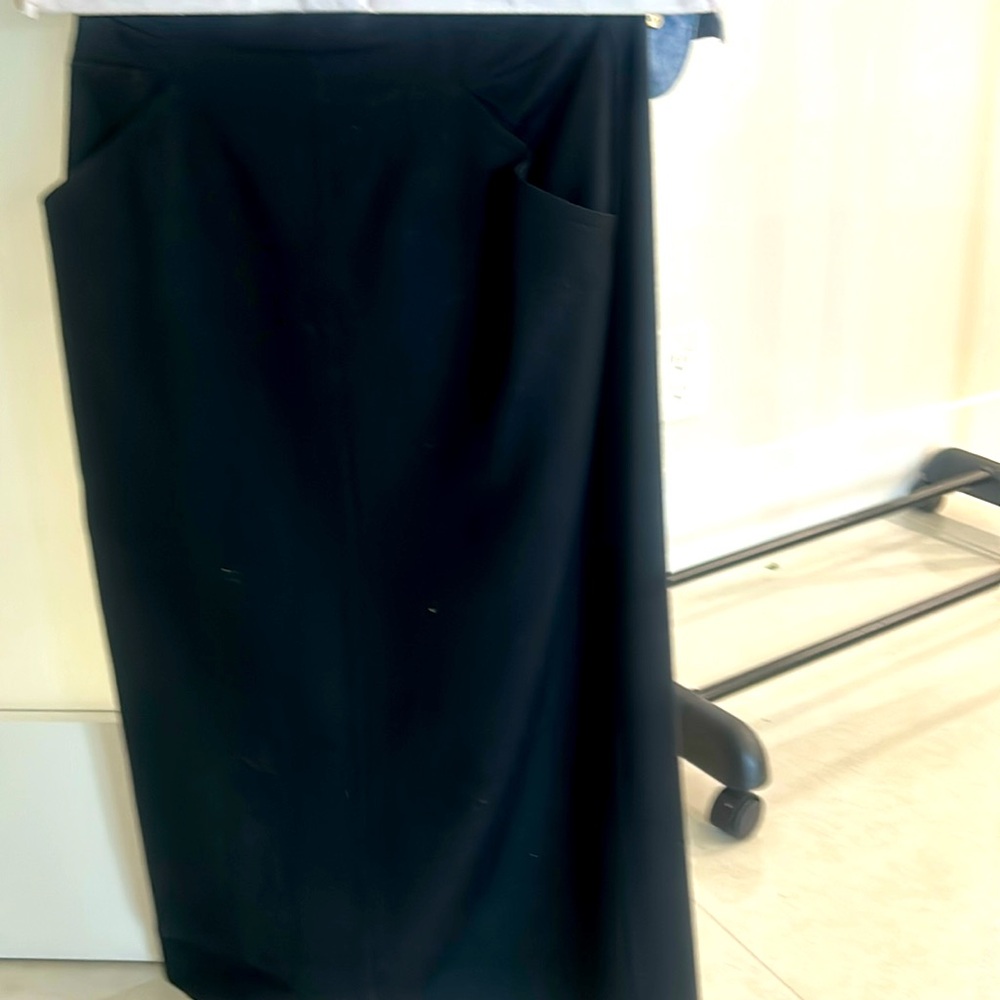 Escada fully lined wool pencil skirt with front pockets, zipper in the back